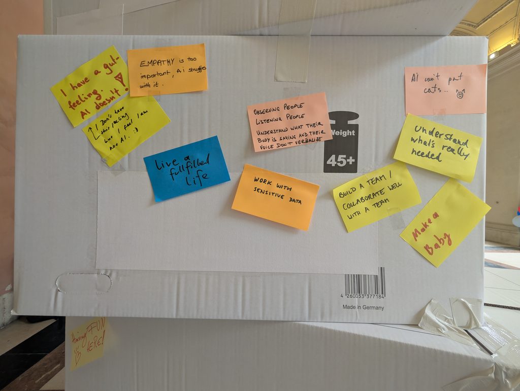 The side of a cardboard box covered with sticky notes, including “live a fulfilled life”, “WORK WITH SENSITIVE DATA”, “Understand what's really needed” and “Make a Baby”.